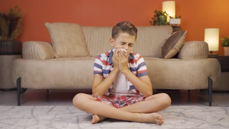 Boy-covering-his-mouth-and-nose-with-a-tissue-while-sneezing.